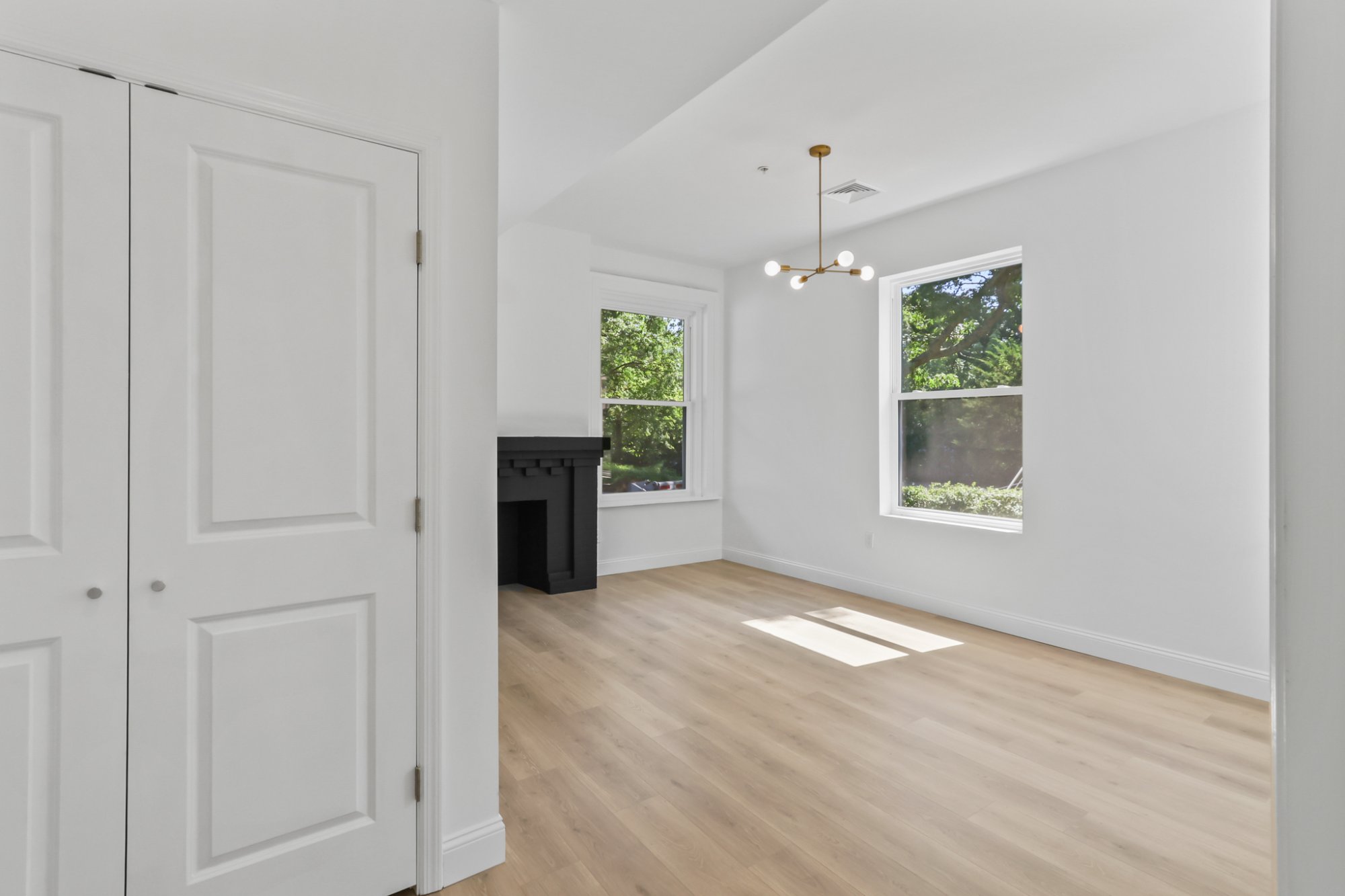 Living room bay windows and kitchen