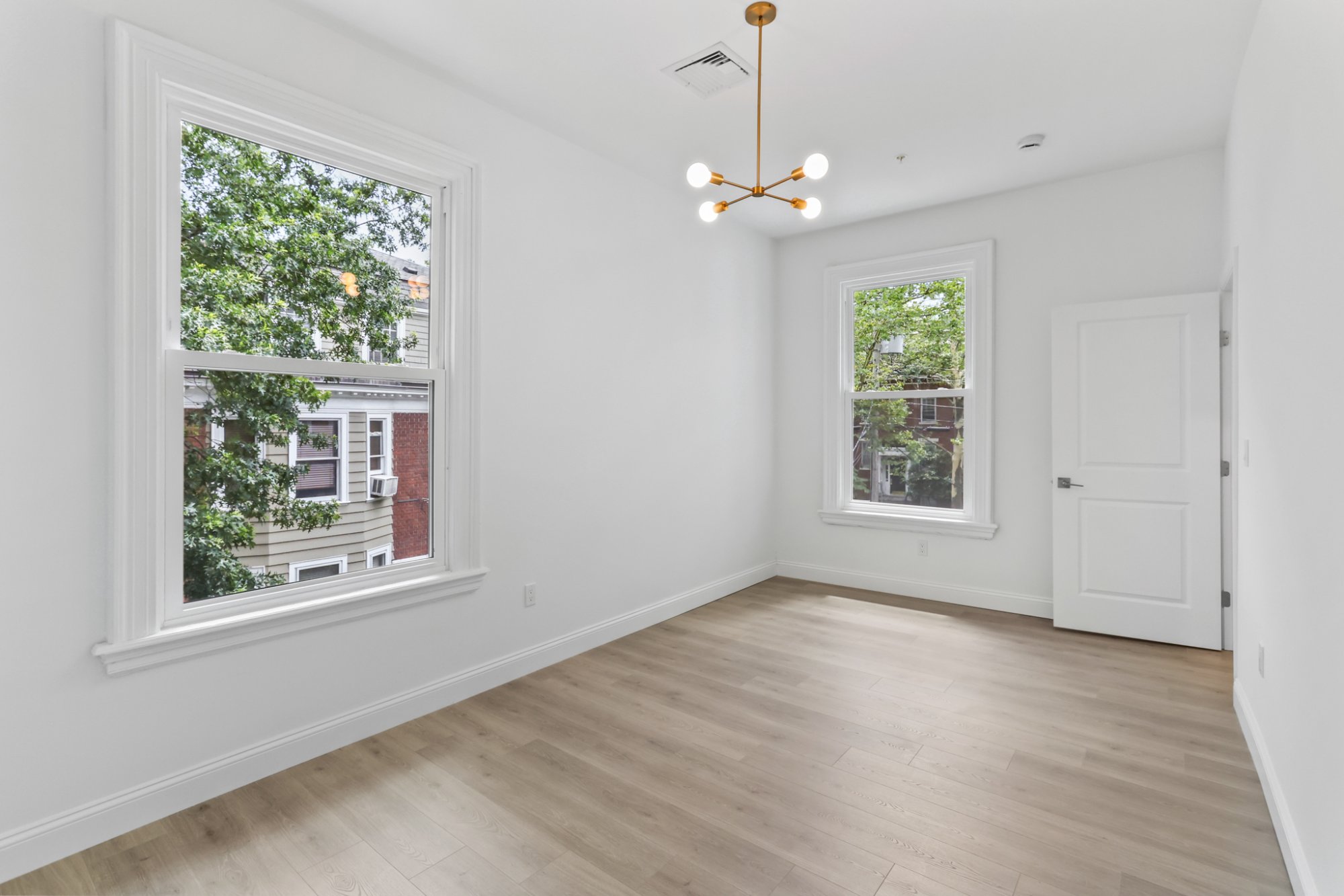 Living room bay windows and kitchen