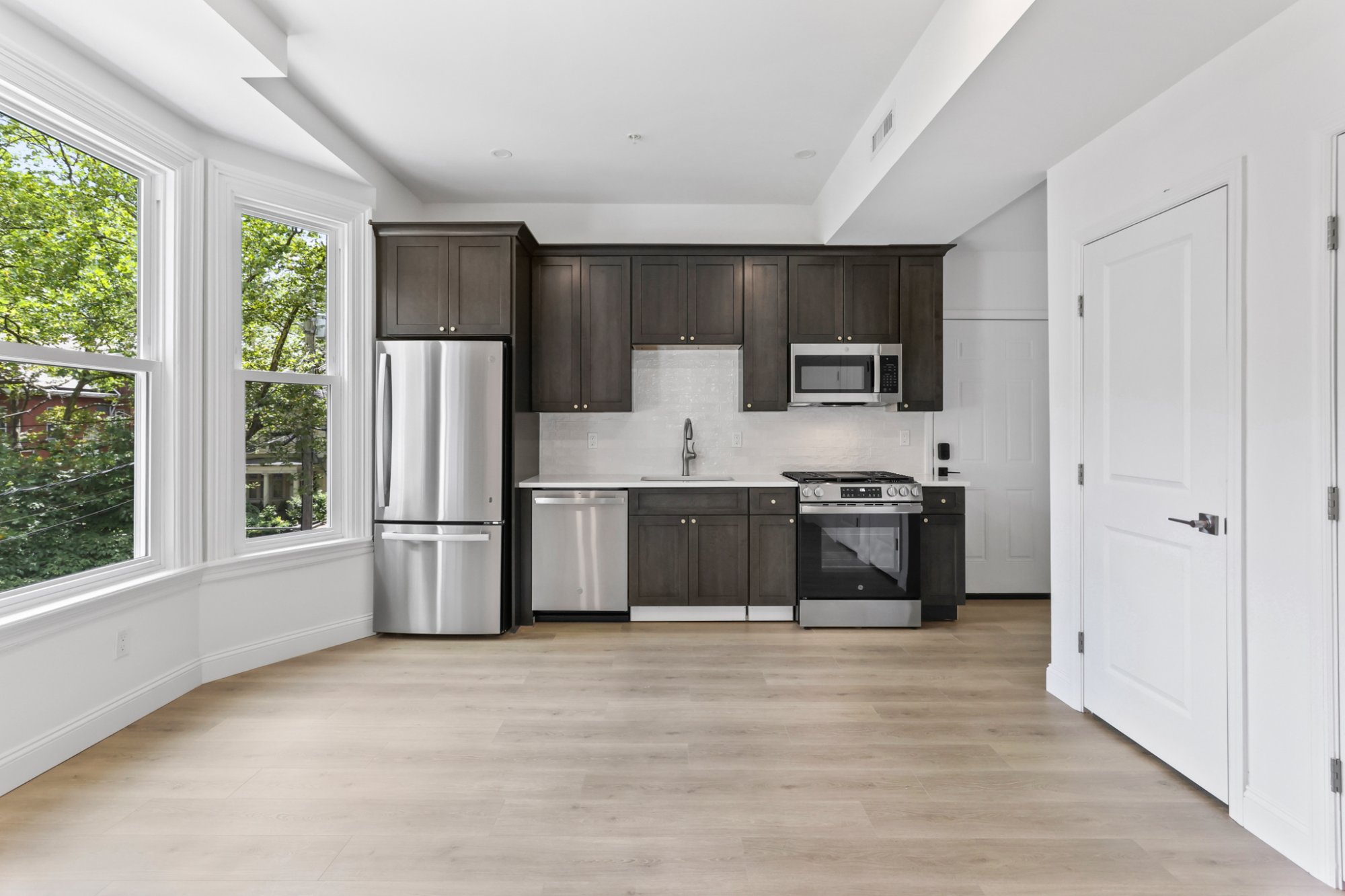 Kitchen full view dark cabinets