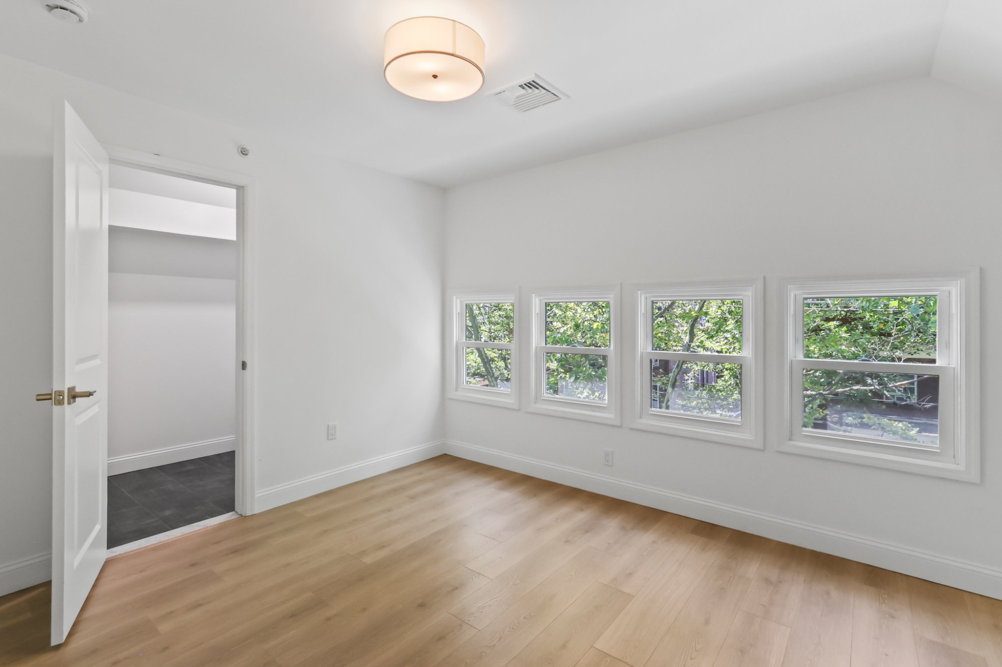 Bedroom four windows tree views