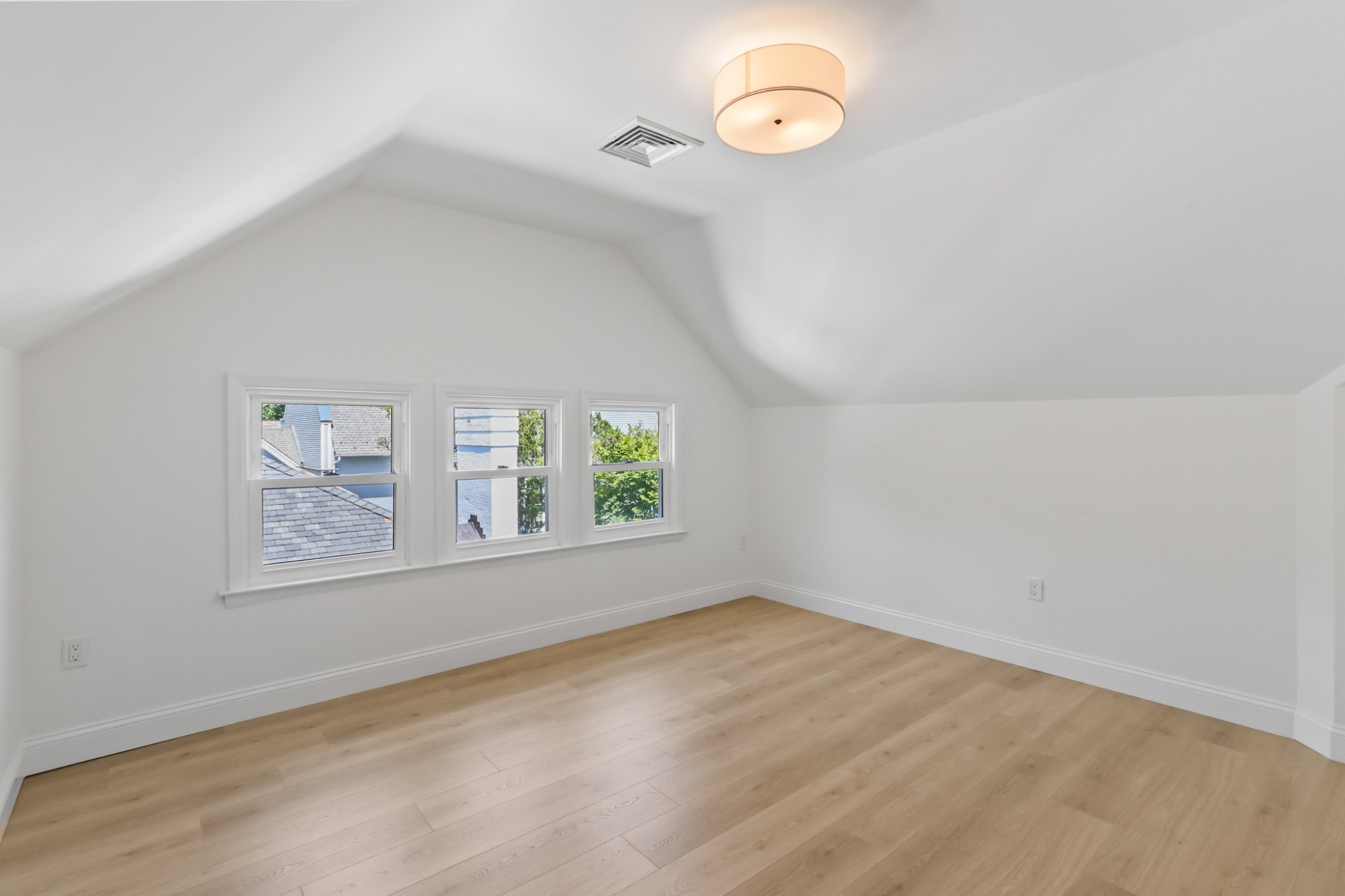 Bedroom with exposed beam vaulted